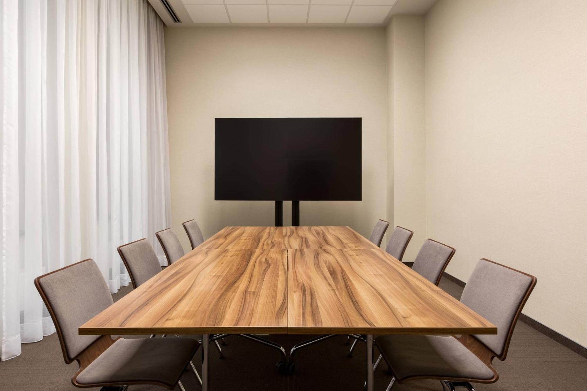Ac Hotel By Marriott Wroclaw Exterior photo A meeting room with a monitor
